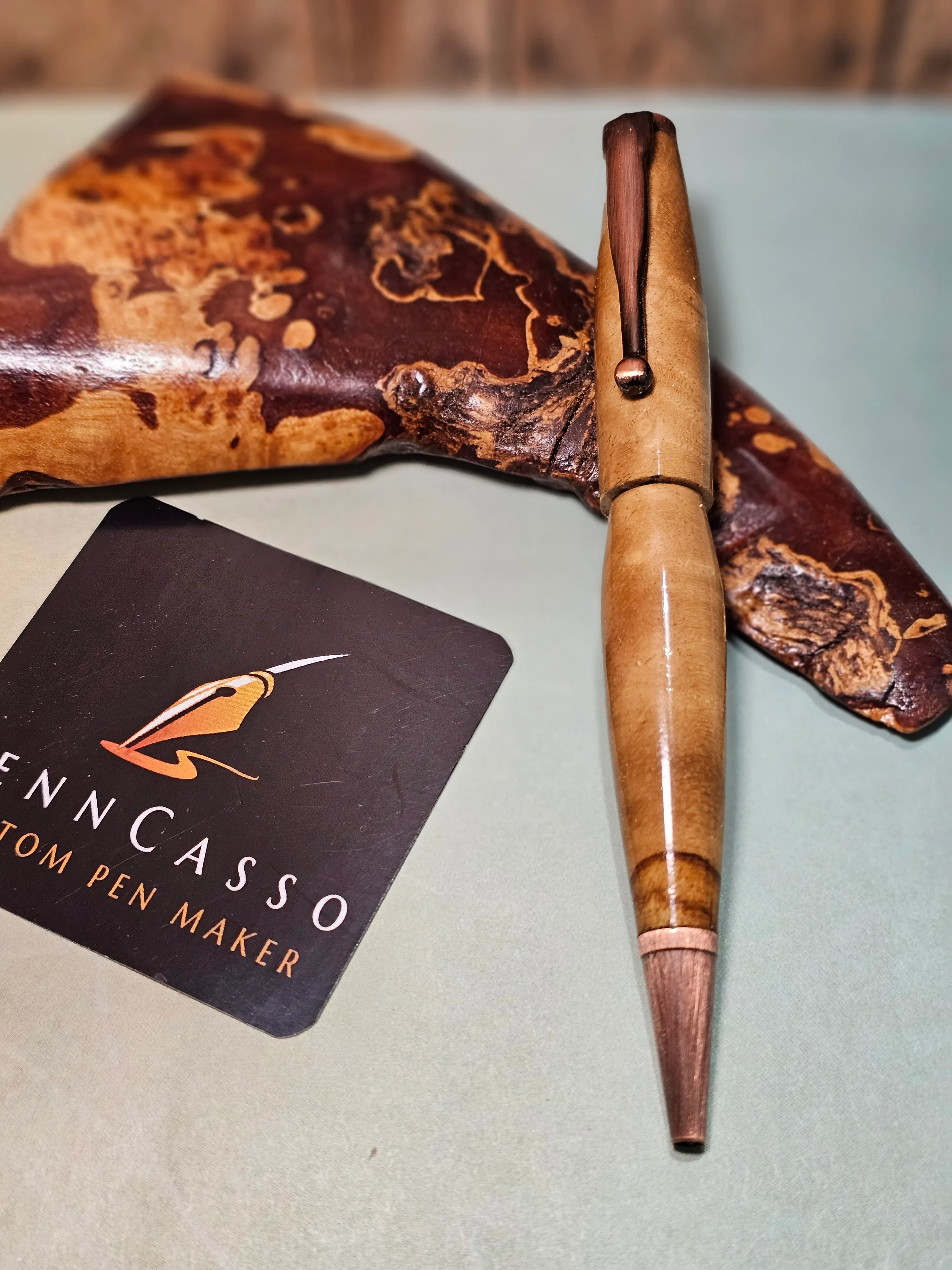 Pair of pens on a natural burl-wood display